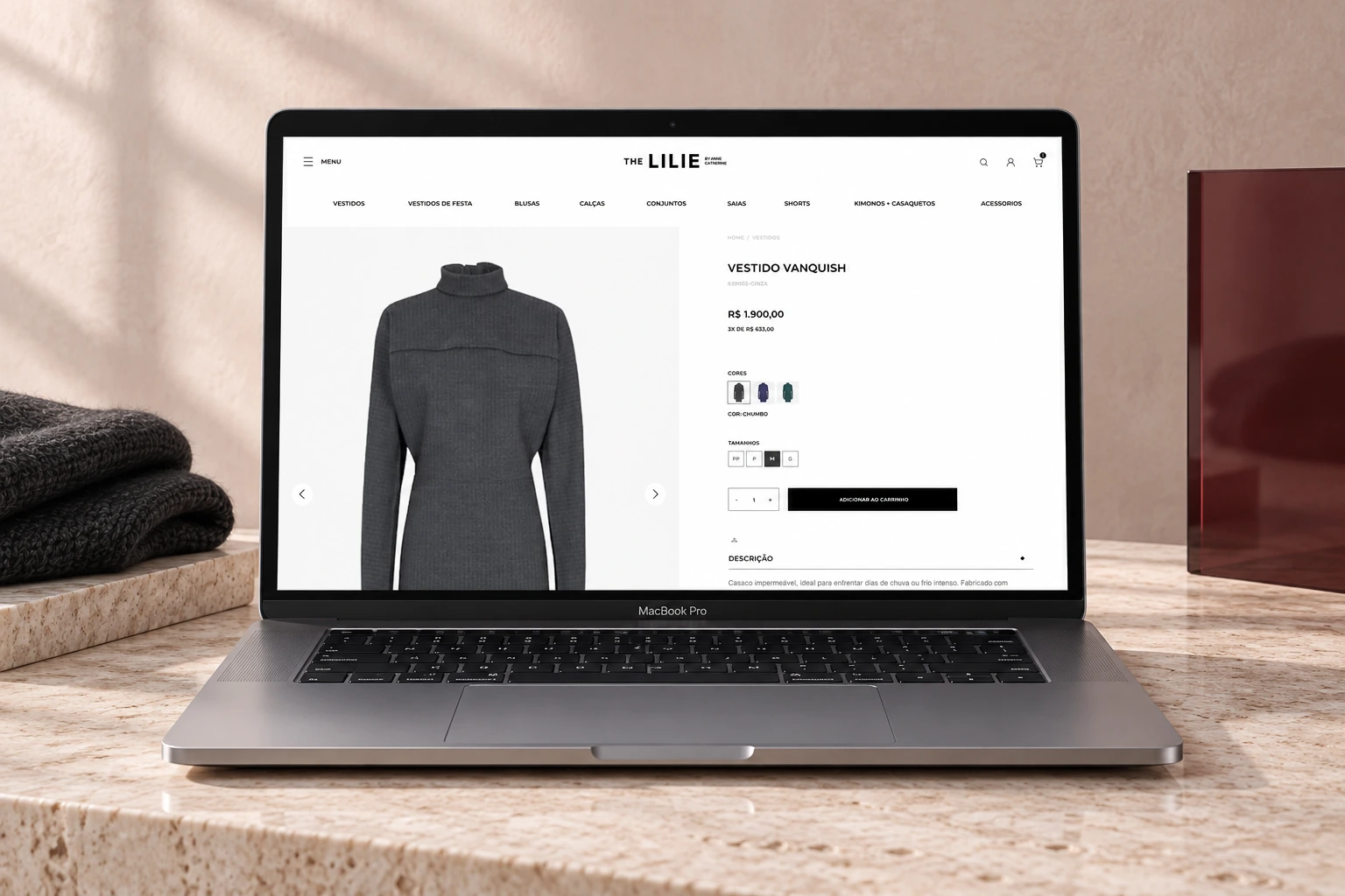 The Lilie product-detail page displayed on a MacBook Pro in a blush editorial studio set.